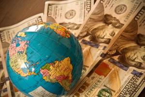 US Dollar currency and world globe