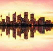 Warmed toned sunset illuminating Sydney, Australia skyline