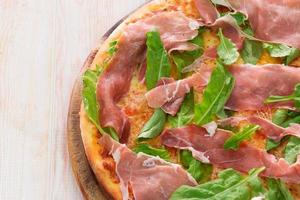Pizza with dry cured ham photo