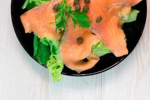 Smoke salmon with salad photo