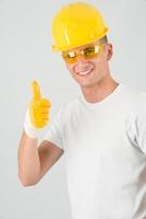 Young architect with thumbs up gesture photo
