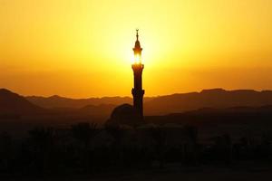 mosque in egypt at sunset photo
