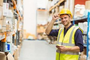 Portrait of warehouse worker with clipboard photo