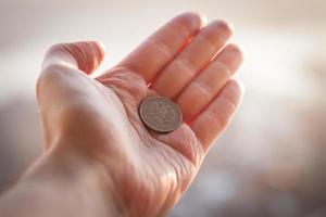 Coin in hand. photo