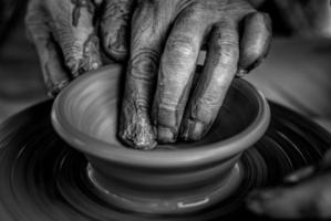 Hands on the pottery wheel photo