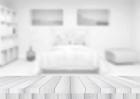 Wooden table looking out to a de-focused bedroom vector