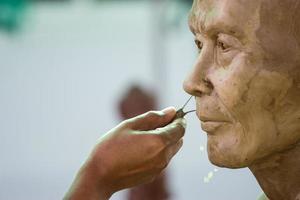 buddha face by wax photo