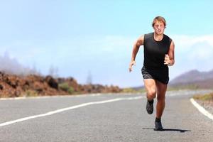 Man running / sprinting on road photo