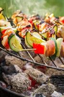 Hot skewers on the grill with fire