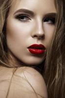 Beautiful woman with evening make-up and long straight hair photo