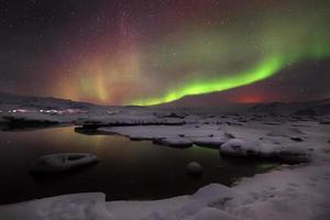 Mixed aurora dancing over the Jokulsarlon lagoon, Iceland