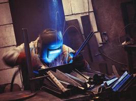 Worker at his workplace welding