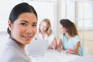 Casual businesswoman smiling at camera during meeting photo