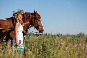 Woman and horse in summer day, outdoors. Series photo
