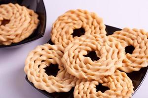 Murukku is a savoury snack popular in South India. photo
