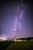 Milky way above rice fields mountains starry night