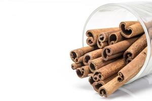 Cinnamon sticks in a glass photo