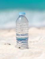 Water in bottle on beach