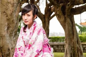 Asian woman kimono in garden photo