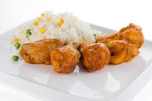 Curry chicken with rice on a white plate photo