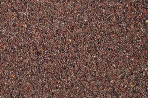 semillas de mostaza marrón como fondo foto