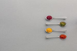 Variety of Eastern Spices in Silver Spoons