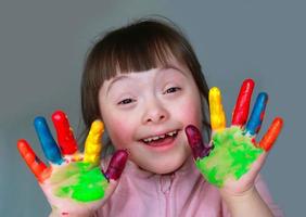 Cute little girl with painted hands photo