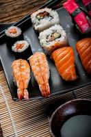 Seafood, Japanese sushi on the old wooden table photo