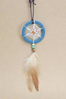 Dream-catcher on the vintage brown background