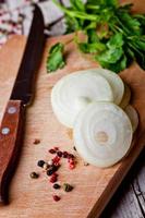 fresh sliced onion, peppercorns and parsley photo