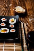Wonderful sushi set, oriental theme on the old wooden table photo