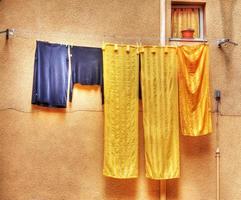 yellow and blue clothes hanging on a laundry line