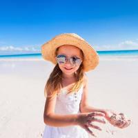 Adorable little girl at beach photo