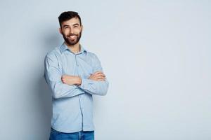 Handsome young bearded man smiling photo