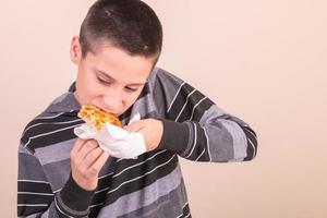 kid eating pizza photo