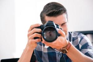 Man shooting with photo camera