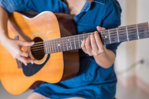 girl playing acoustic guitar isolate on white photo