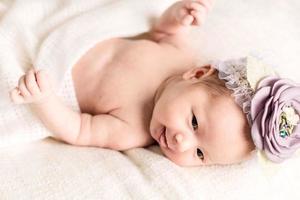 Portrait of newborn baby girl  with  headband photo
