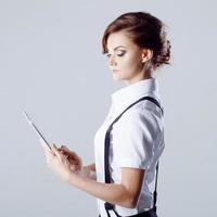 Successful business woman, on white background, with laptop in hand