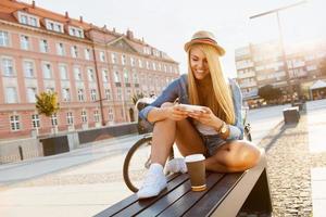 Young stylish woman with a bicycle photo