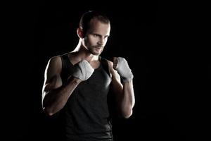muscular man, hour boxer, black background, horizontally photo