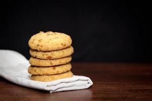 Stack of apple chip cookies on white napkin photo