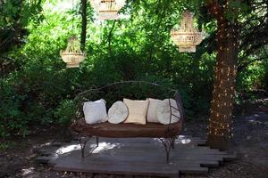 garden sofa with decorations photo