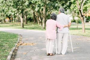 Senior couple embracing in park photo