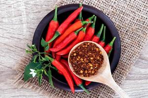 Fresh and crushed red chili peppers  photo