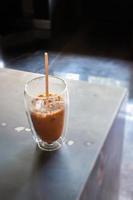 Iced coffee in coffee shop on top of wooden table
