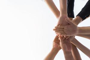Human hands in a team huddle