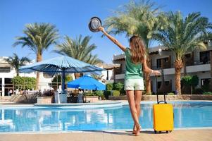 Beautiful woman near hotel pool  photo