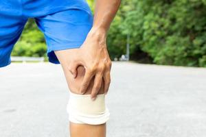 Man with blue running shorts takes a rest break  photo