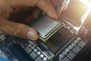 Close up hand of computer technician at work photo